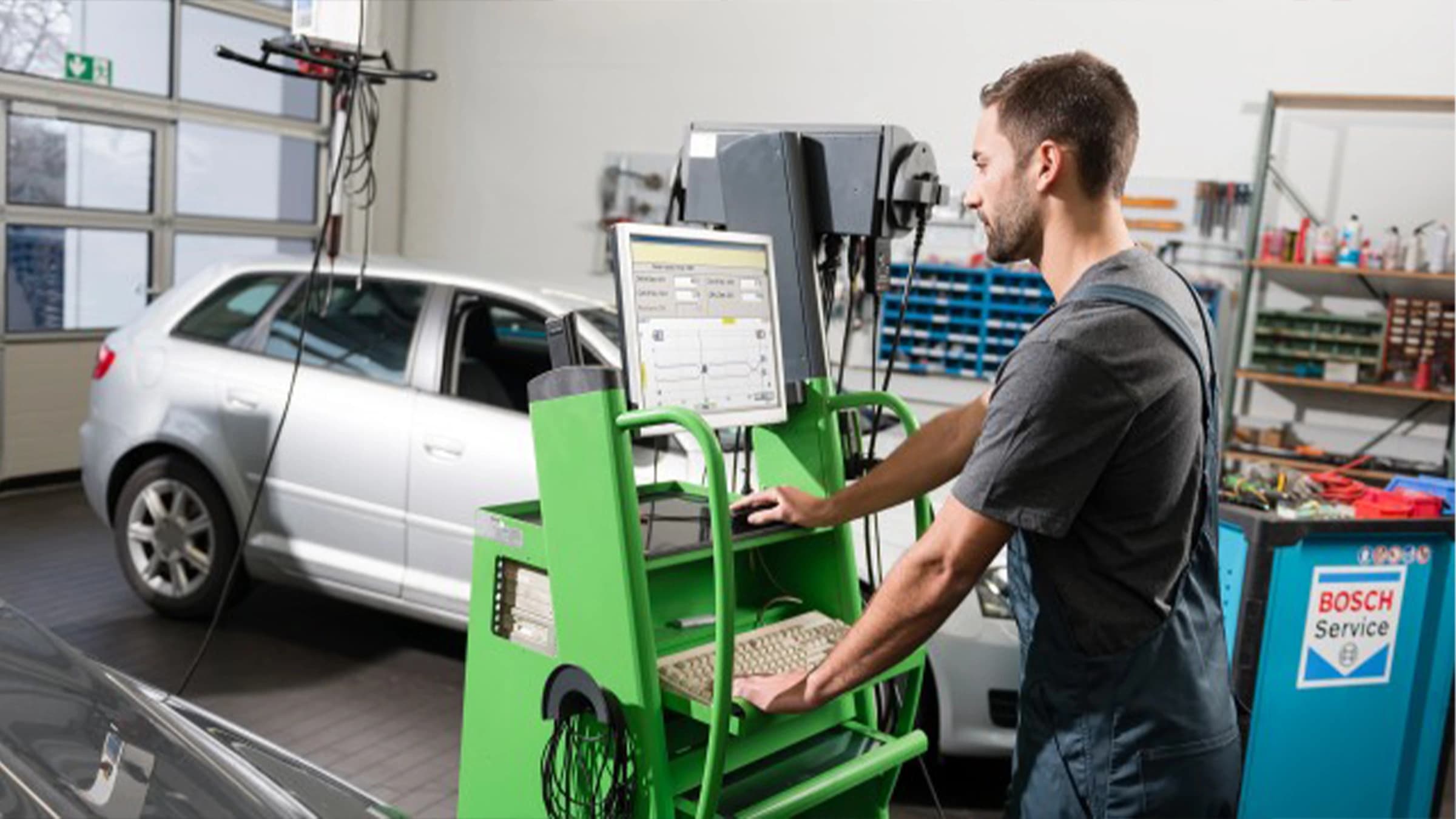 Technician checking a car at TGS Autos